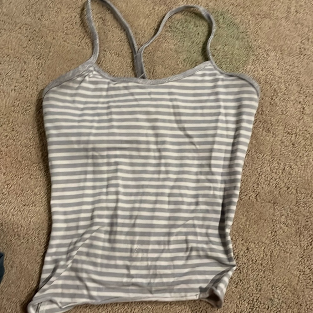 Movies are in striped tank top